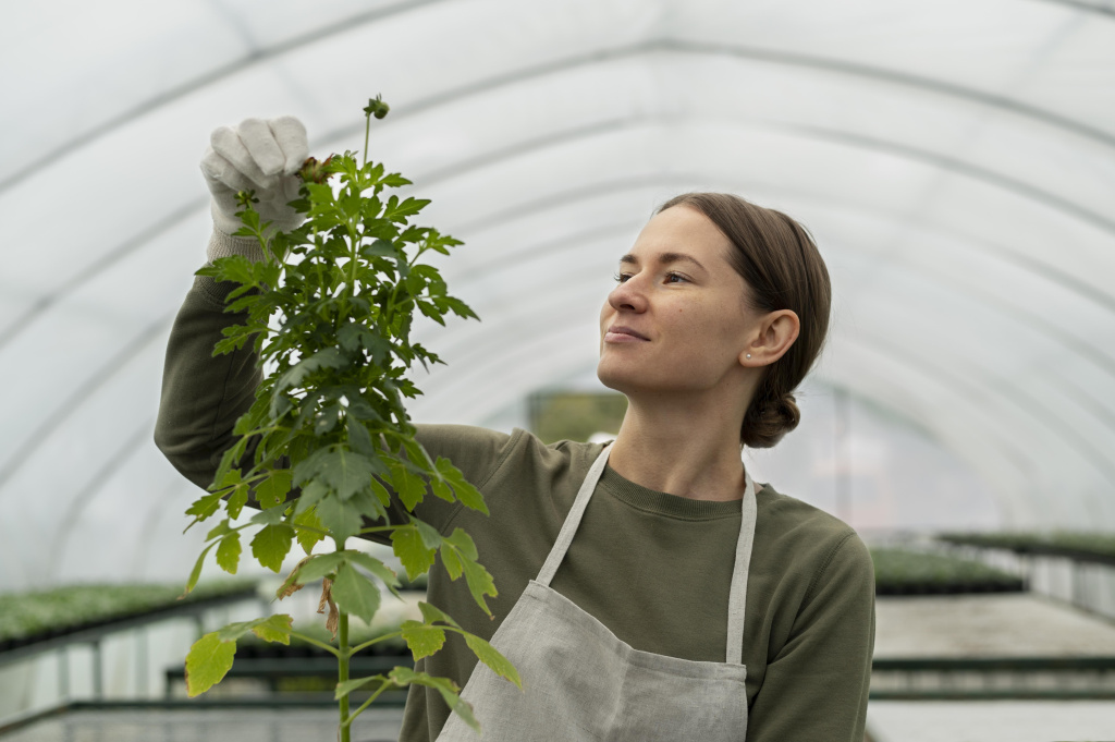 medium-shot-woman-checking-plant.jpg
